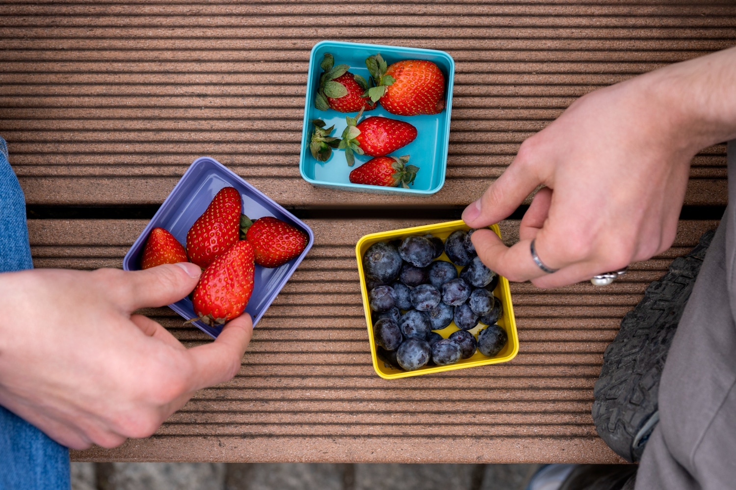 portion-control-plates-strawberries-berries-hands-taking