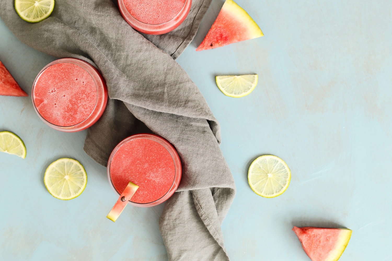 Raw Juice Watermelon cuts blue background